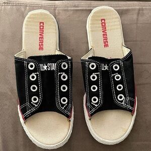 NWOB Converse Black Canvas cutaways Sneakers with White Eyelets.